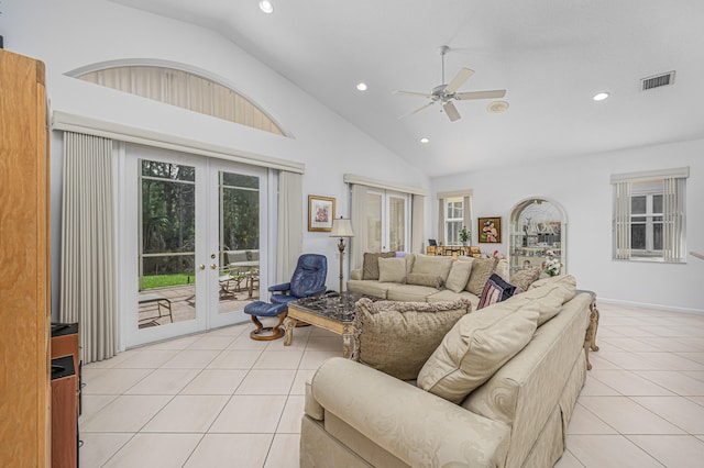 tiled living room featuring high vaulted ceiling, ceiling fan, and french doors