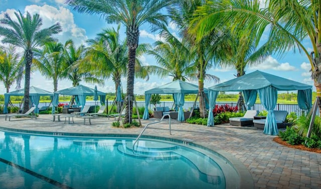 view of pool with a patio area and a gazebo