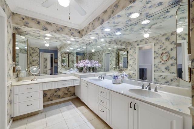 bathroom featuring tile patterned floors, ceiling fan, crown molding, and vanity