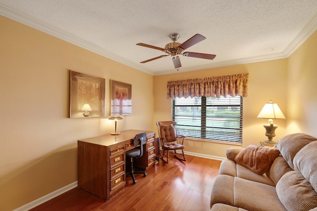 home office with ornamental molding, a textured ceiling, wood-type flooring, and ceiling fan