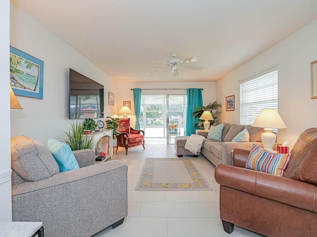 tiled living room featuring ceiling fan