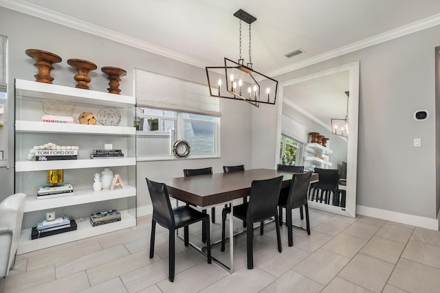 dining space with an inviting chandelier, light tile patterned flooring, and ornamental molding