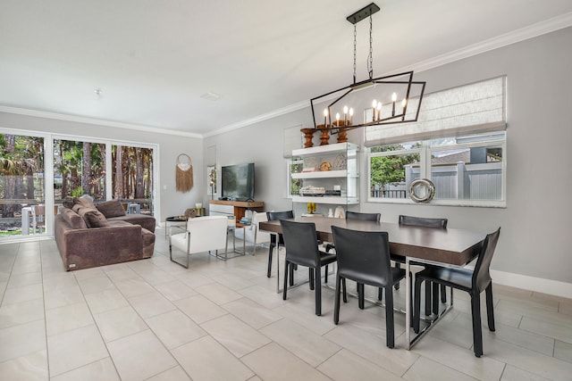 dining room with ornamental molding, a chandelier, and light tile patterned floors