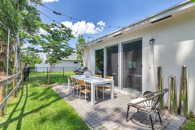 view of patio featuring a grill