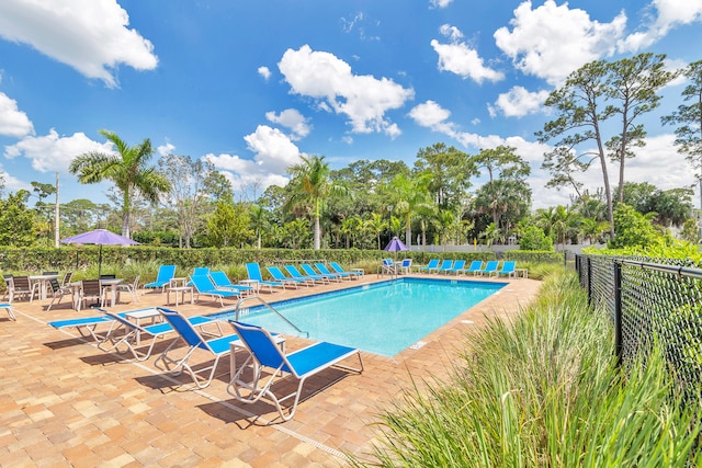 view of swimming pool featuring a patio area