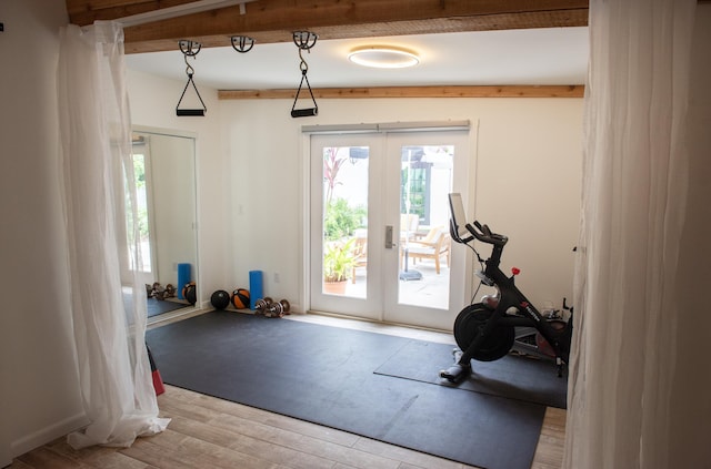 exercise area with french doors and wood finished floors