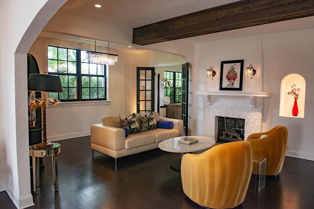 sunroom featuring wood ceiling and plenty of natural light