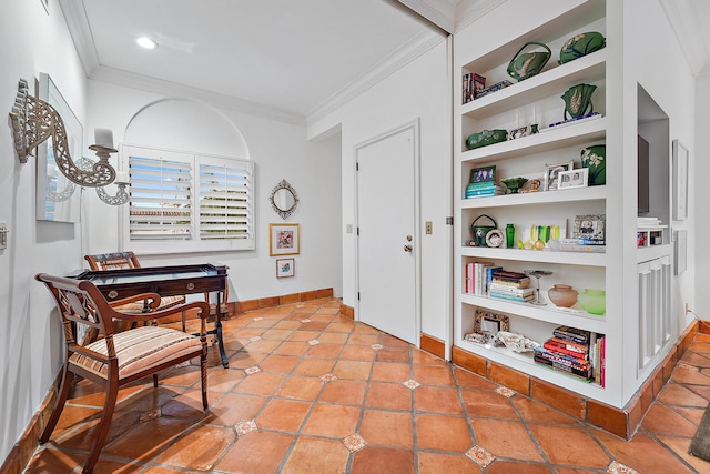 interior space with built in shelves, ornamental molding, and tile patterned floors