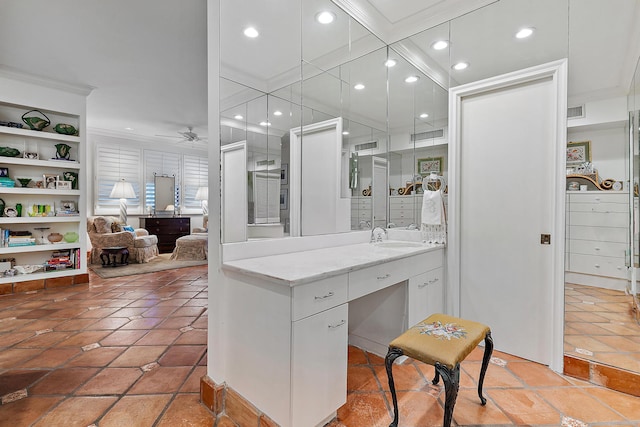 bathroom featuring ornamental molding, sink, ceiling fan, and tile patterned floors