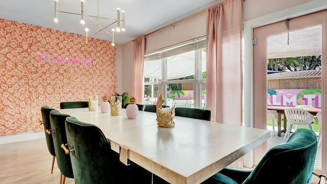 2600 NE 30th St, Fort Lauderdale, FL 33306 - dining space with wallpapered walls and wood finished floors