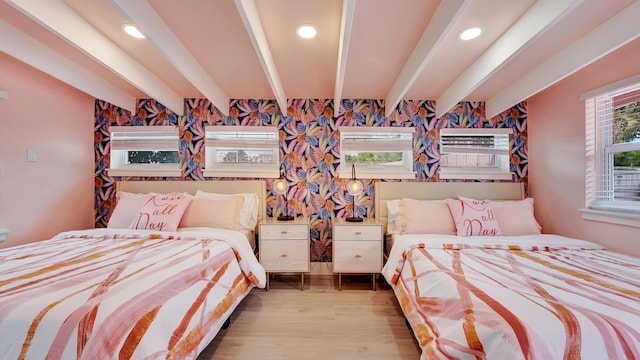 2600 NE 30th St, Fort Lauderdale, FL 33306 - bedroom featuring wood finished floors, an AC wall unit, and beam ceiling