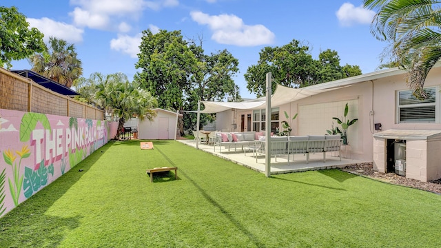 2600 NE 30th St, Fort Lauderdale, FL 33306 - view of yard featuring a storage shed, a patio area, fence, an outdoor hangout area, and an outbuilding
