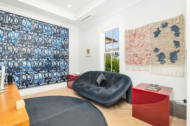 sitting room featuring crown molding and parquet floors