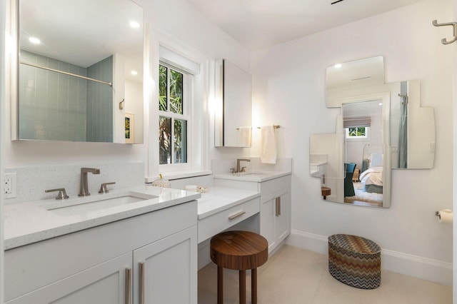 bathroom featuring vanity, tile patterned floors, and a shower with shower door