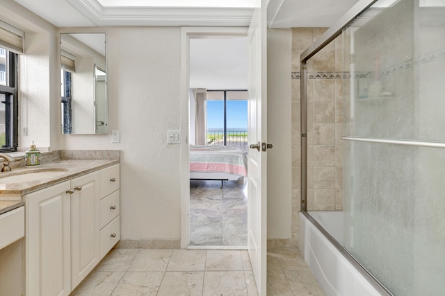 bedroom featuring expansive windows, multiple windows, a closet, and access to exterior