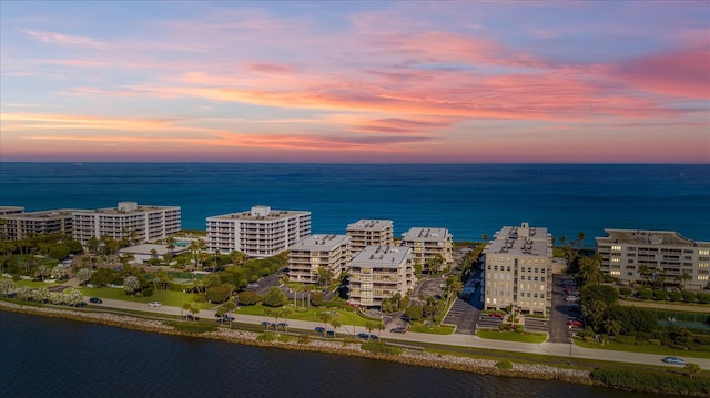 aerial view at dusk with a water view