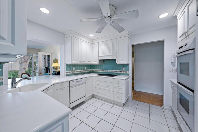 kitchen featuring white cabinetry, white appliances, premium range hood, ceiling fan, and decorative backsplash