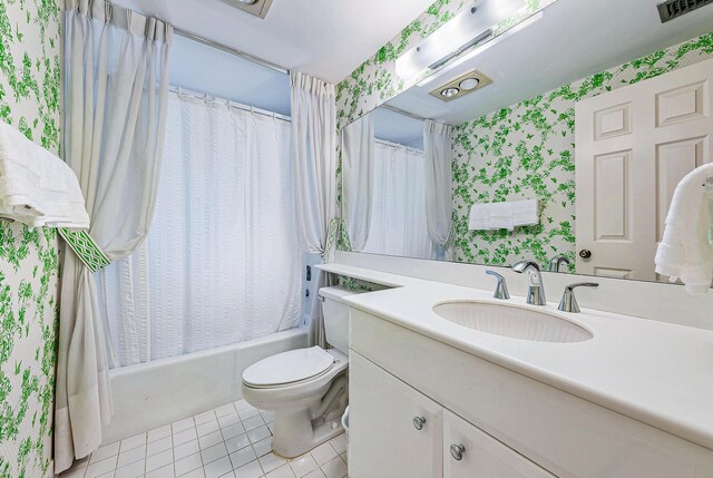 full bathroom featuring tile patterned flooring, toilet, shower / tub combo with curtain, and vanity