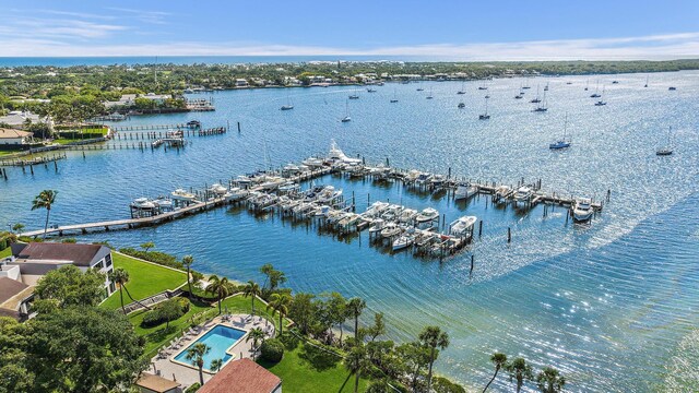 birds eye view of property with a water view