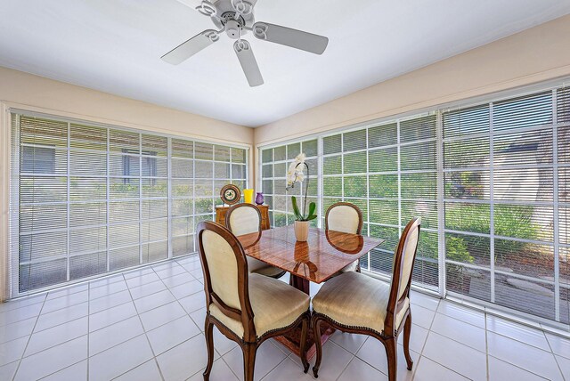 sunroom featuring ceiling fan