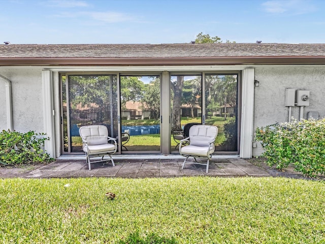 rear view of house featuring a lawn