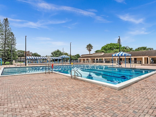 view of swimming pool featuring a gazebo and a patio area