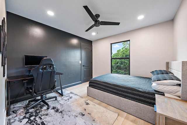 bedroom featuring ceiling fan and light wood-type flooring