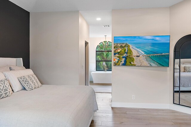 bedroom with light wood-type flooring