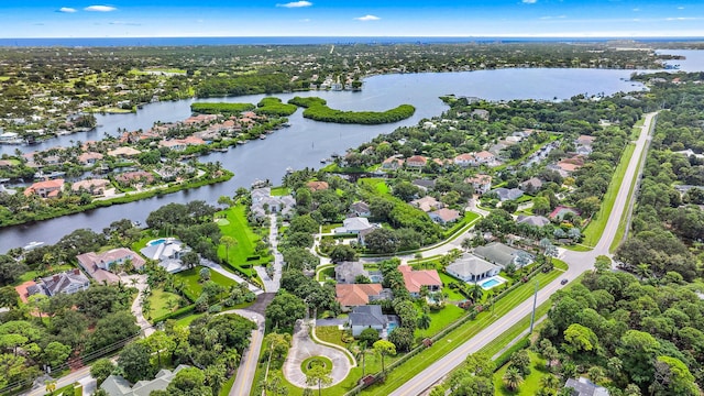 birds eye view of property featuring a water view