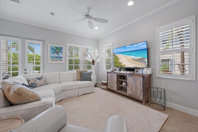 living room with ceiling fan and crown molding