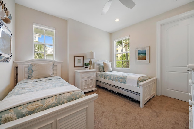 bedroom featuring recessed lighting, a ceiling fan, and light colored carpet