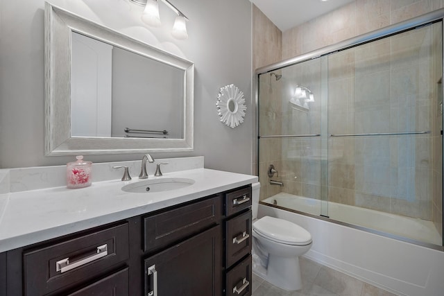 full bathroom with enclosed tub / shower combo, vanity, toilet, and tile patterned floors