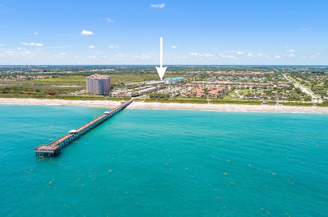 aerial view featuring a view of the beach and a water view