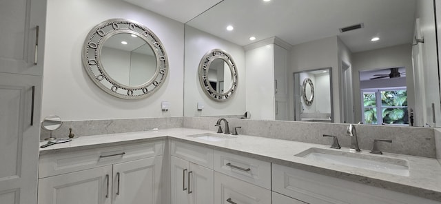 bathroom featuring vanity and ceiling fan