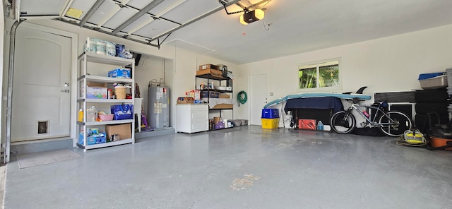 garage with electric water heater and a garage door opener