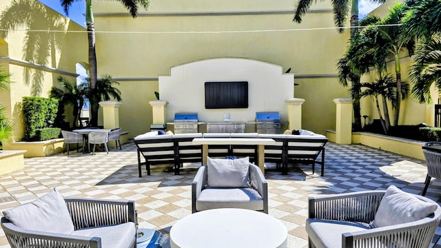 701 S Olive Ave Unit 202, West Palm Beach, FL 33401 - view of patio with an outdoor hangout area, exterior kitchen, outdoor dining area, and a grill