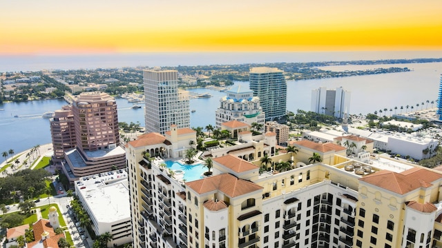 aerial view at dusk with a water view