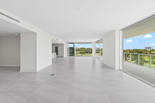 220 SE Mizner Blvd Unit 523, Boca Raton, FL 33432 - spare room with expansive windows, baseboards, and light marble finish floors