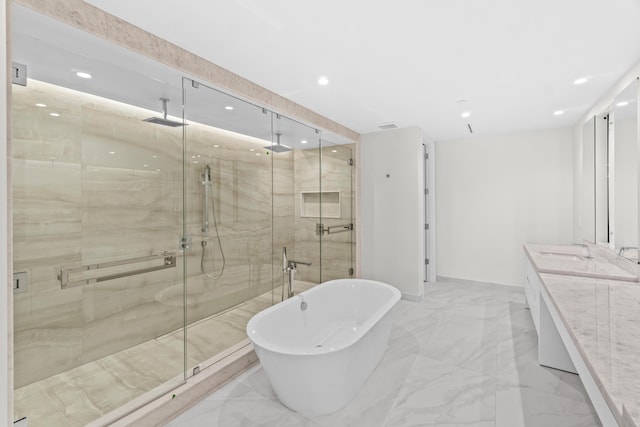 220 SE Mizner Blvd Unit 523, Boca Raton, FL 33432 - full bath featuring marble tiled floors, a freestanding tub, recessed lighting, a shower stall, and vanity
