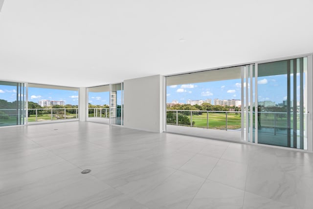 220 SE Mizner Blvd Unit 523, Boca Raton, FL 33432 - tiled spare room with a wall of windows and a city view
