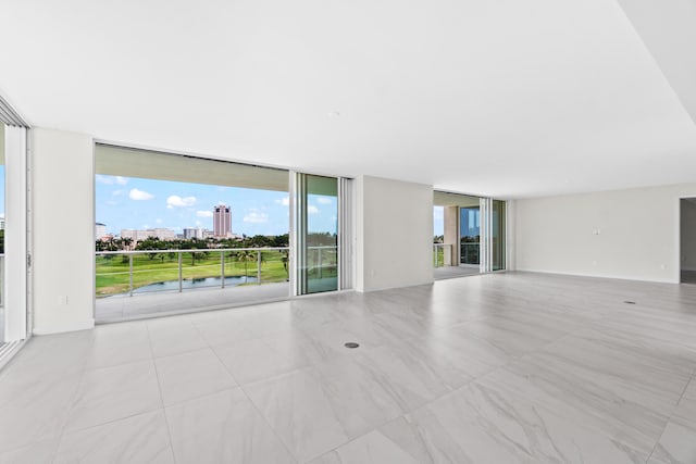 220 SE Mizner Blvd Unit 523, Boca Raton, FL 33432 - unfurnished living room with a wall of windows and a city view