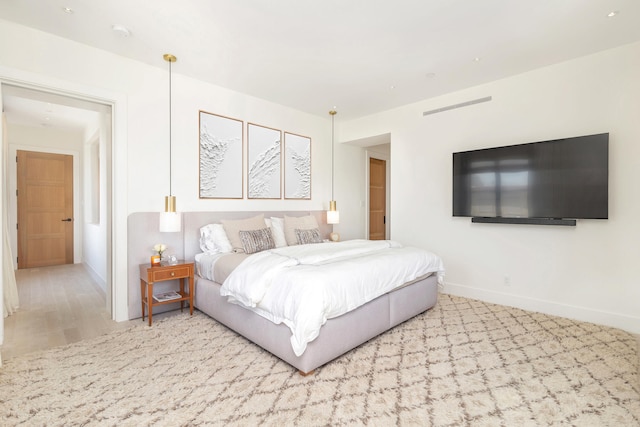 bedroom with light wood-type flooring