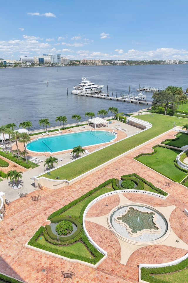 surrounding community with a water view, a patio, and a pool