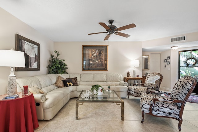 tiled living room with ceiling fan