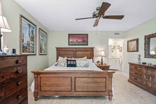 tiled bedroom with ceiling fan and connected bathroom