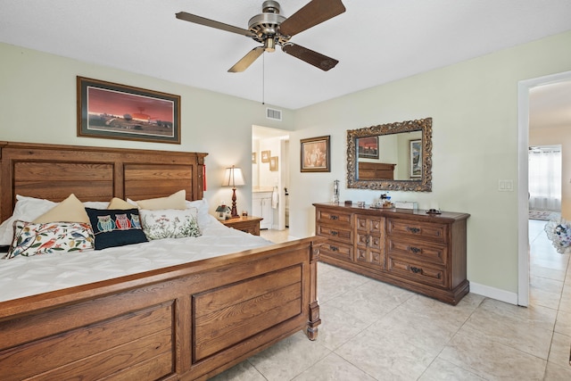 bedroom with ceiling fan, ensuite bathroom, and light tile patterned flooring