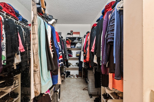 walk in closet featuring light tile patterned floors