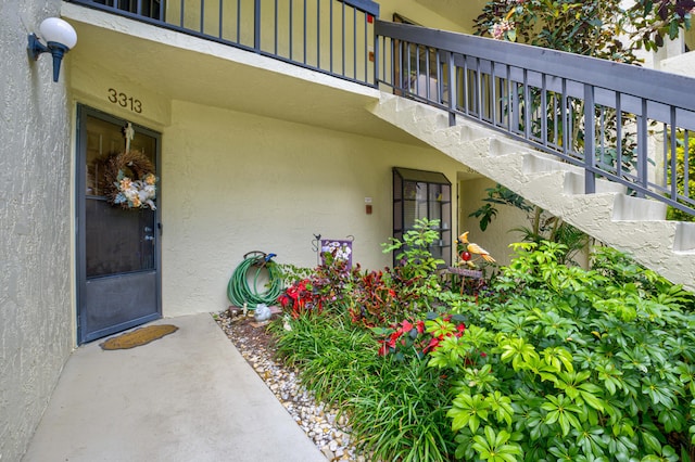 entrance to property with a balcony