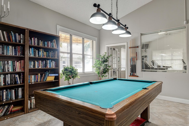 recreation room featuring lofted ceiling, billiards, and a textured ceiling