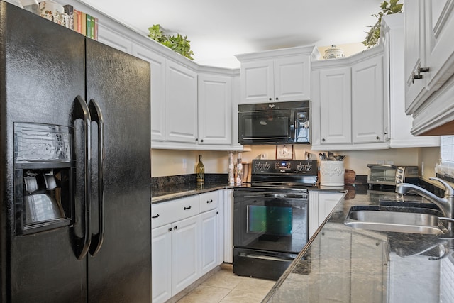 kitchen with black appliances, sink, light tile patterned floors, and white cabinets